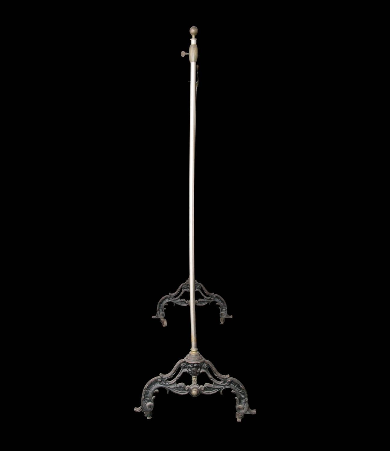Fabulous antique shop coat rack with intricate cast iron base. Perfect for unique retail displays or in a domestic setting.