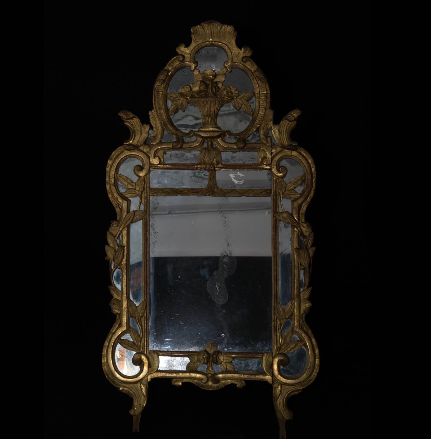 Unusual 18th century French mirror, with original gilding, glass and aged patina.

