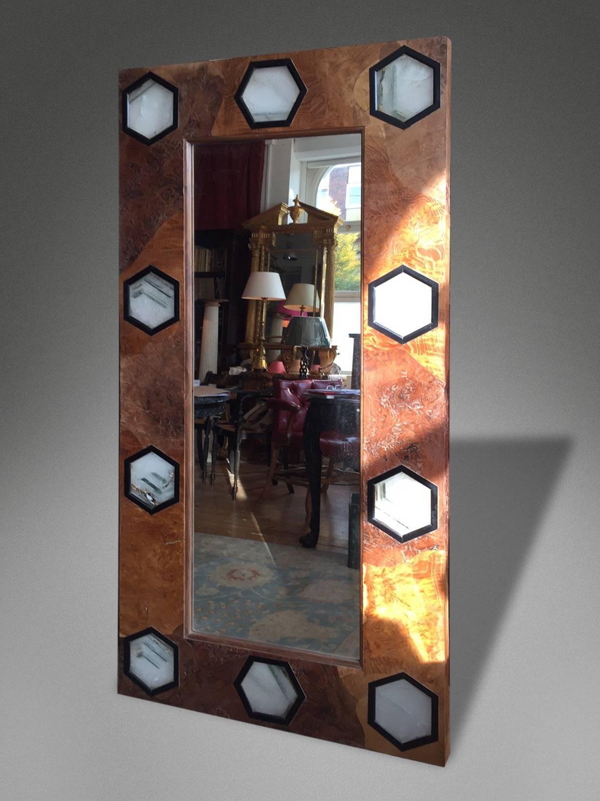 A 1930s style mirror with rare veneers and solid Quartz hexagonal plaques in ebonised frames.

The quartz is backlit with varied colored LED lighting.
