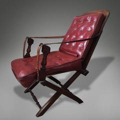 Red Leather Campaign Chair