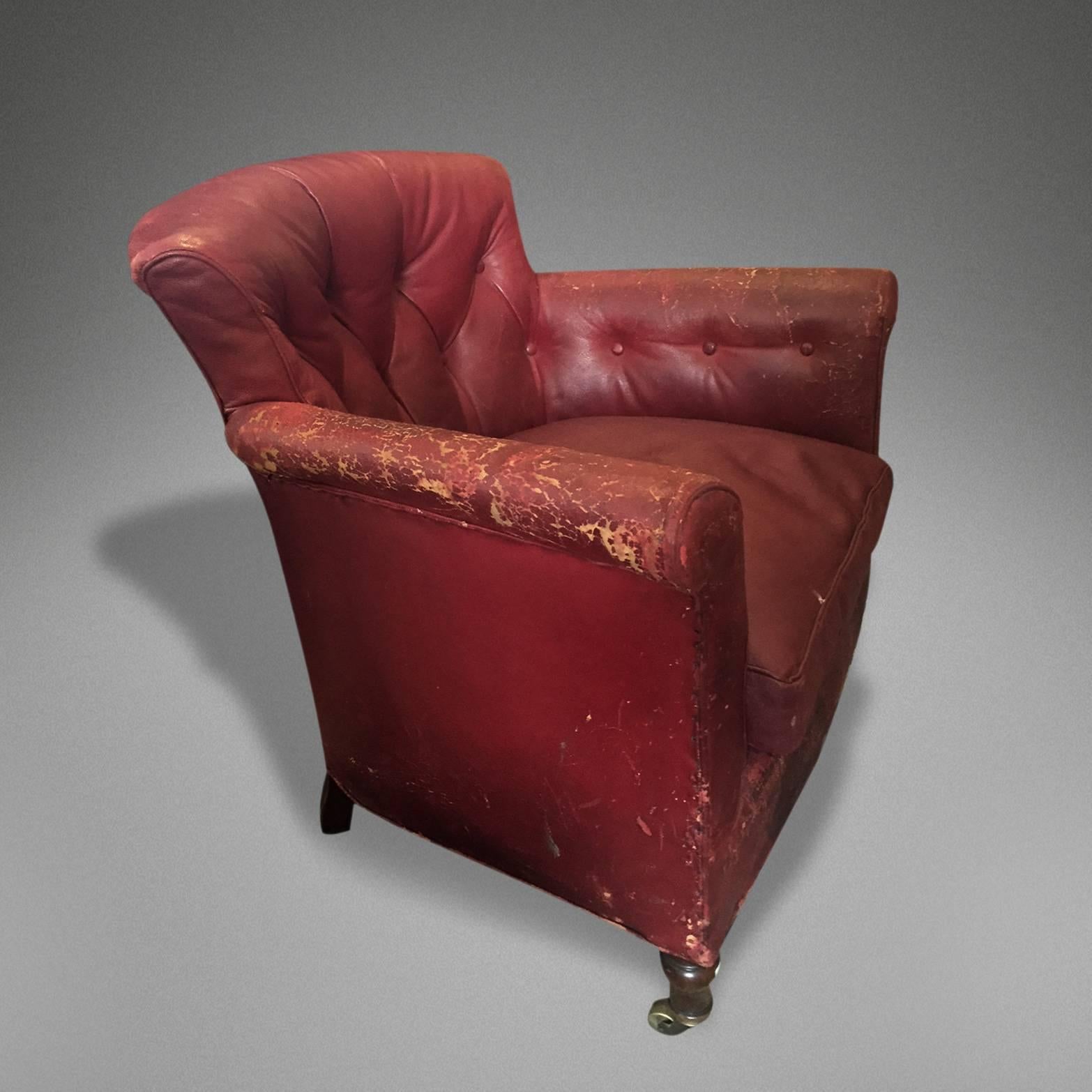 A 19th century Howard & Sons red leather armchair.