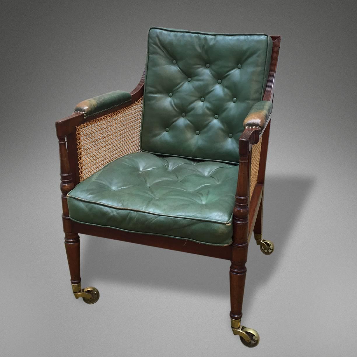 A pair of fine mahogany and cane armchairs.