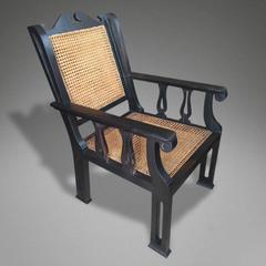 Pair of Solid Ebony and Cane Anglo-Indian Armchairs
