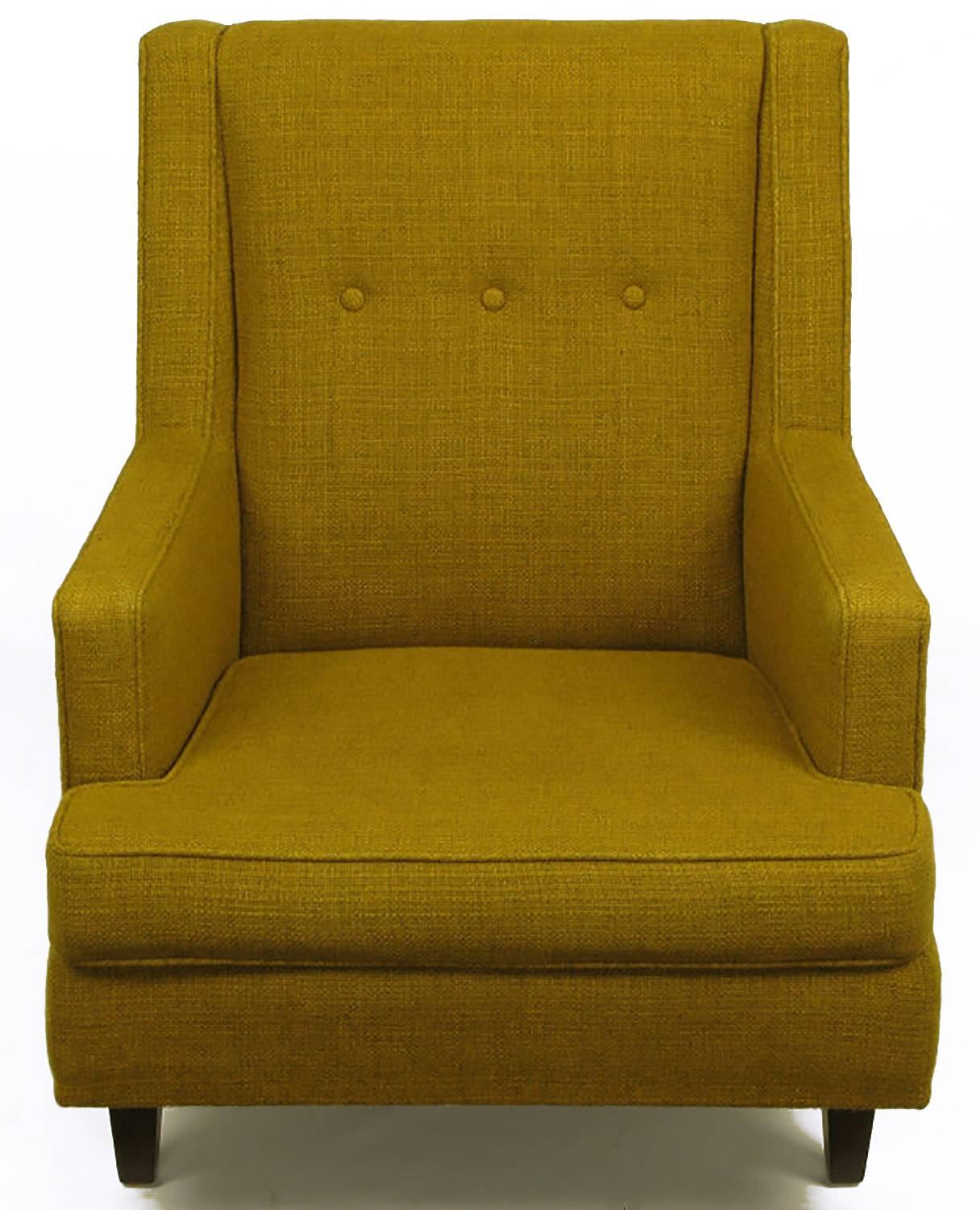 Edward Wormley for Dunbar lounge chair with unique setback front legs, and clad in moss green wool upholstery. Extremely comfortable with deep seat cushion and slight angle of the three button back. Walnut wood legs and original shipping label