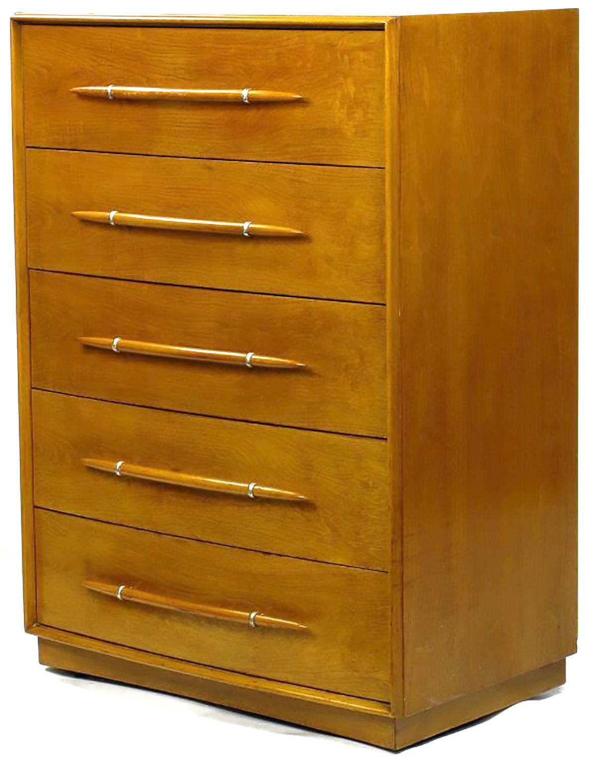 Iconic tall dresser by Robsjohn-Gibbings in beautiful original condition, very well preserved. The silver plated rings that support the tusk shaped wood pulls featured here are less commonly seen than the silver plated tips. As with many of Gibbings