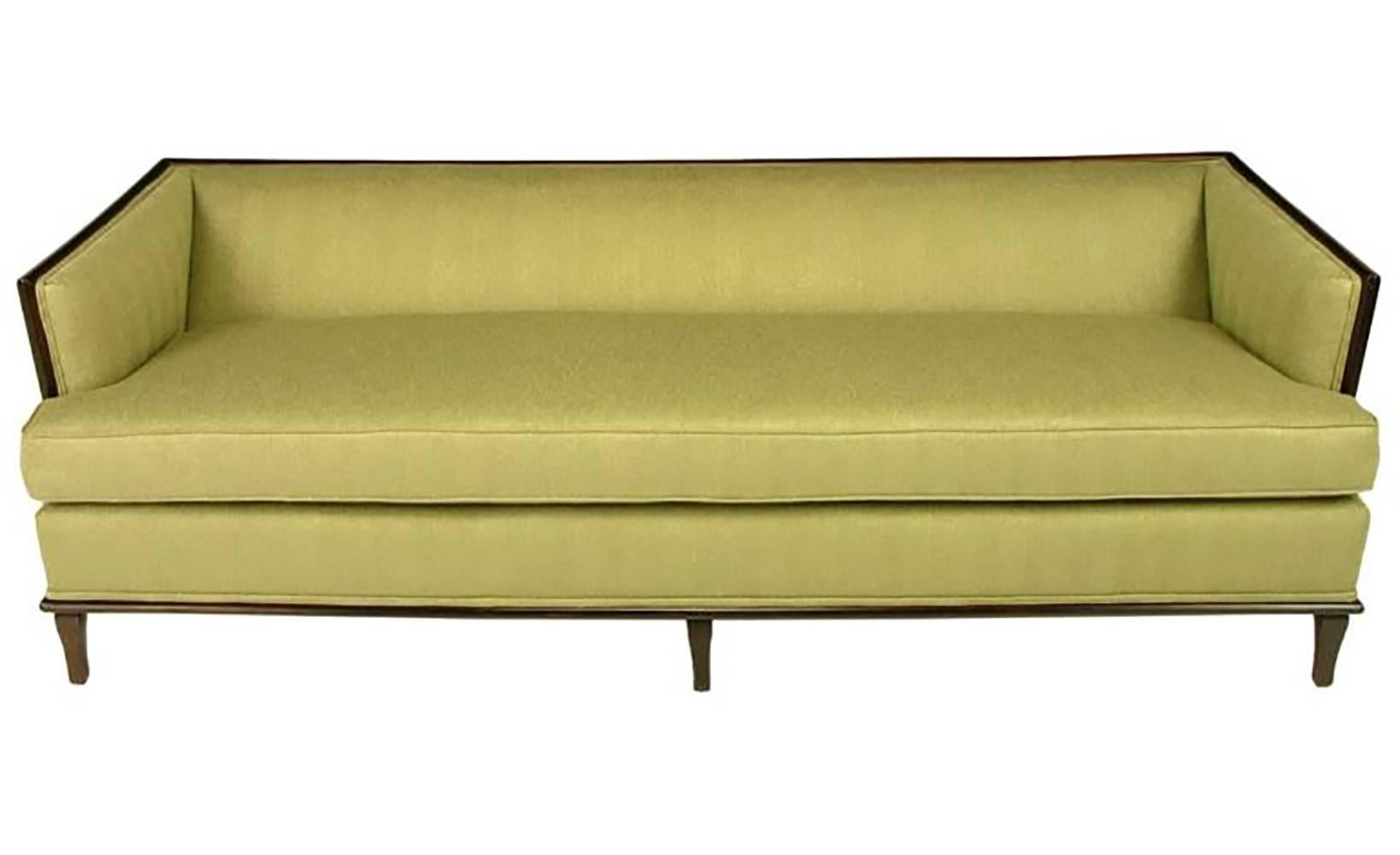 Elegant even arm sofa with exposed mahogany frame with three front legs and saber back legs. Completely restored with new single seat cushion, tight arm and back cushion. Subtly textured sage herringbone silk and linen fabric.