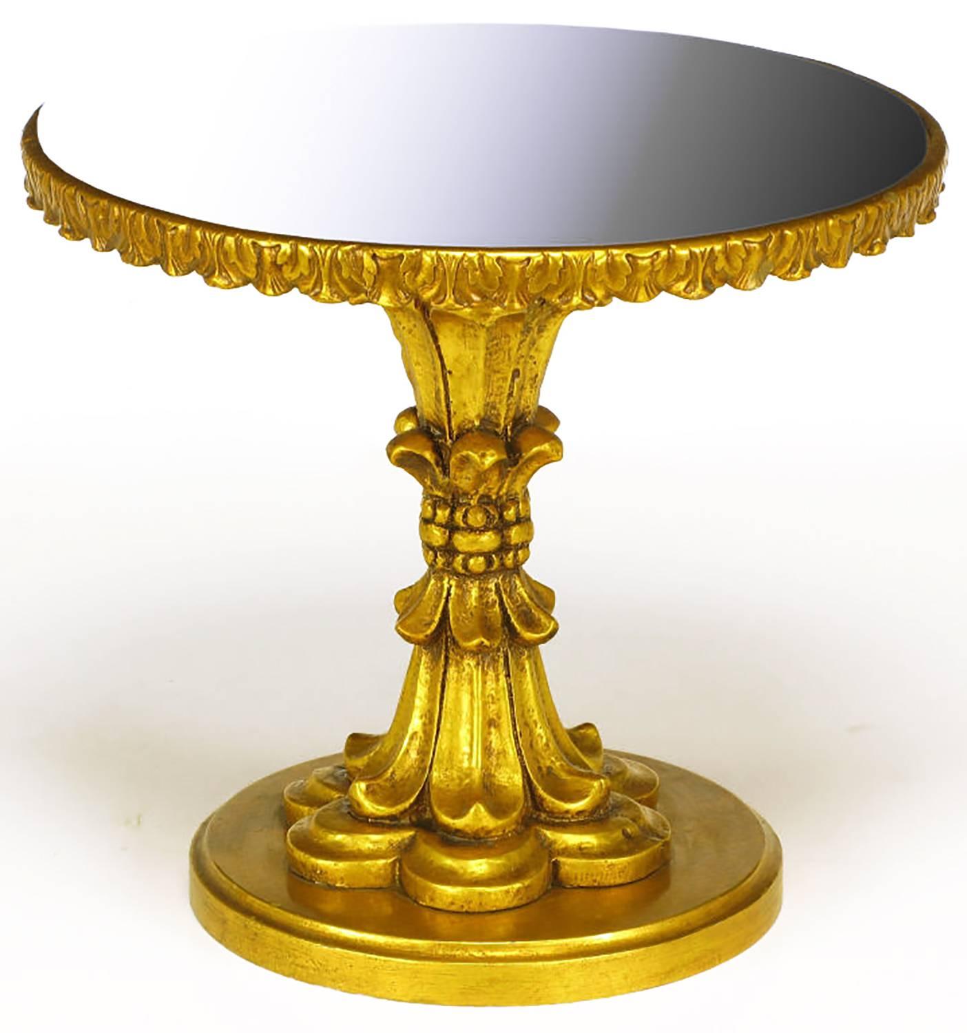 Elegant gueridon side table with inlaid black glass top. French style carved and gilt wood with bound acanthus leaf pedestal and scalloped apron. Also comes with a mirrored glass top, as an alternative to the black glass.