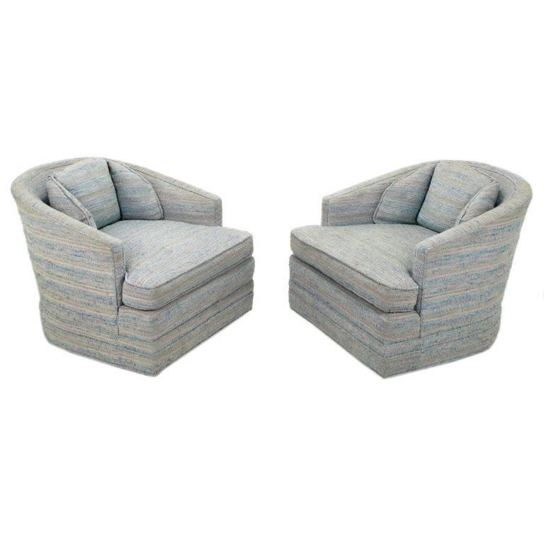 Pair of barrel-back lounge chairs from Knapp & Tubbs in the original heathered blue, lavender and taupe striped fabric, woven in the manner of Dorothy Liebes. Rounded backs have a slight inward taper from top to bottom, adding comfort as well as an
