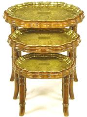 Three Carved Walnut and Etched Brass Tray Nesting Tables