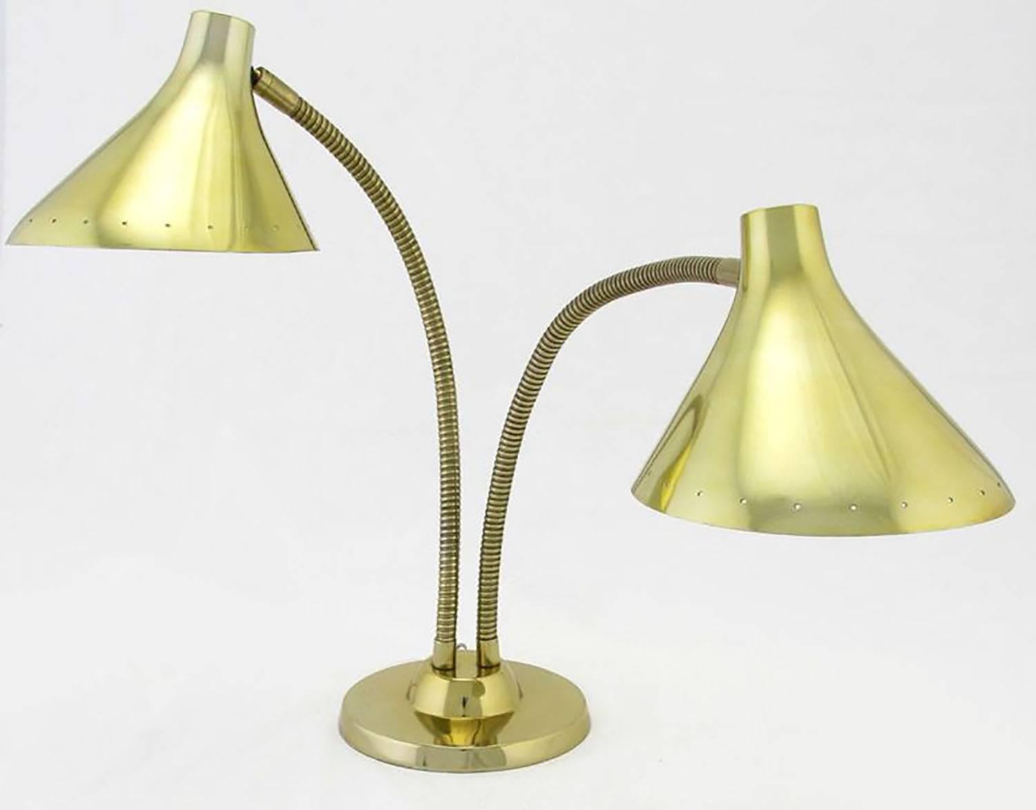 Laurel desk lamp with two pierced edge shades and goose neck stems for unlimited positioning of the lights. Interior of the pierced shades is lacquered white for maximum reflection. On/off switch located to the back of the weighted brass disc base.