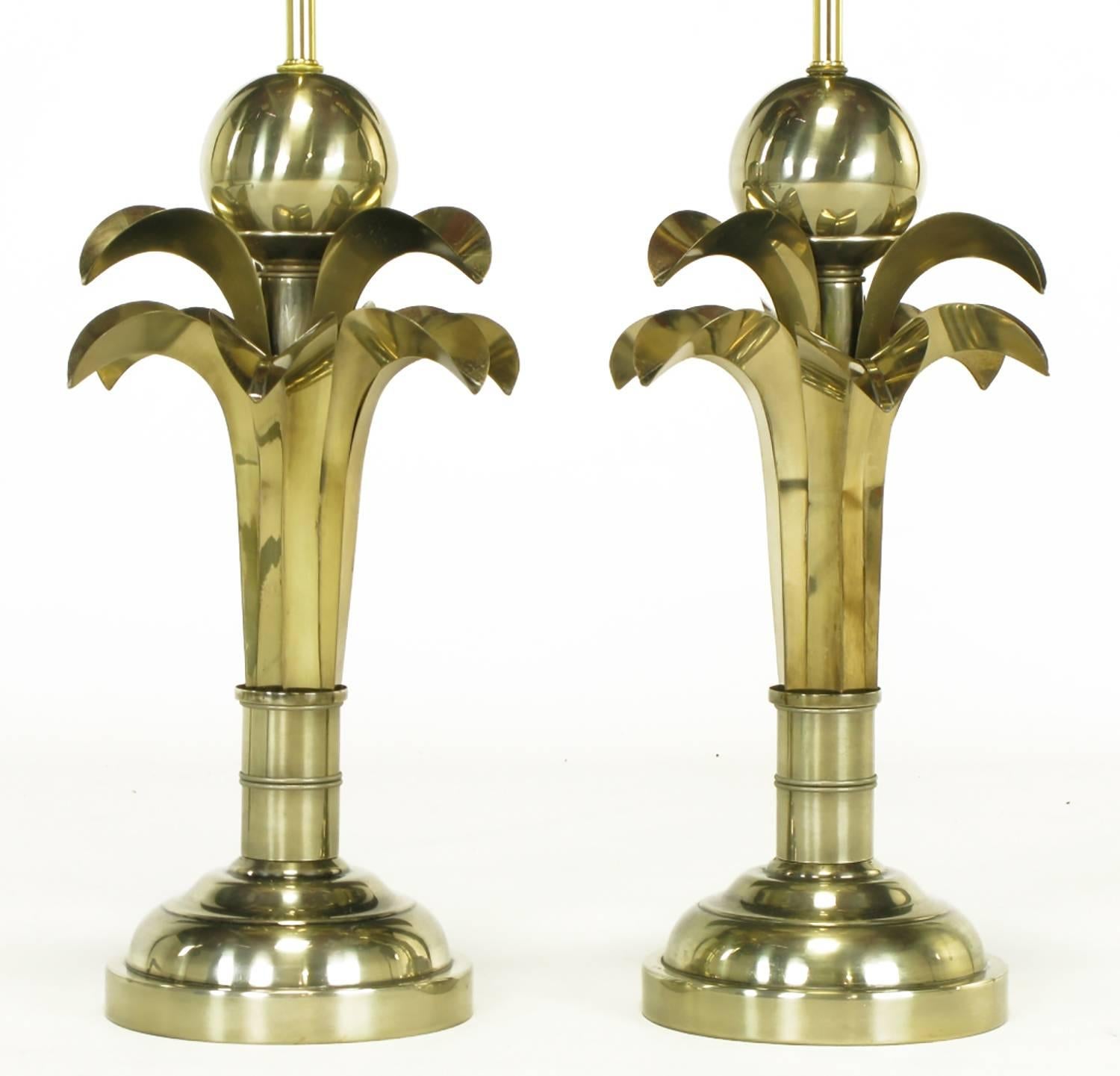 Pair of stylized palm tree table lamps in gold metal by Hart Associates. Half sphere bases, large stylized bamboo stem, two layers of 