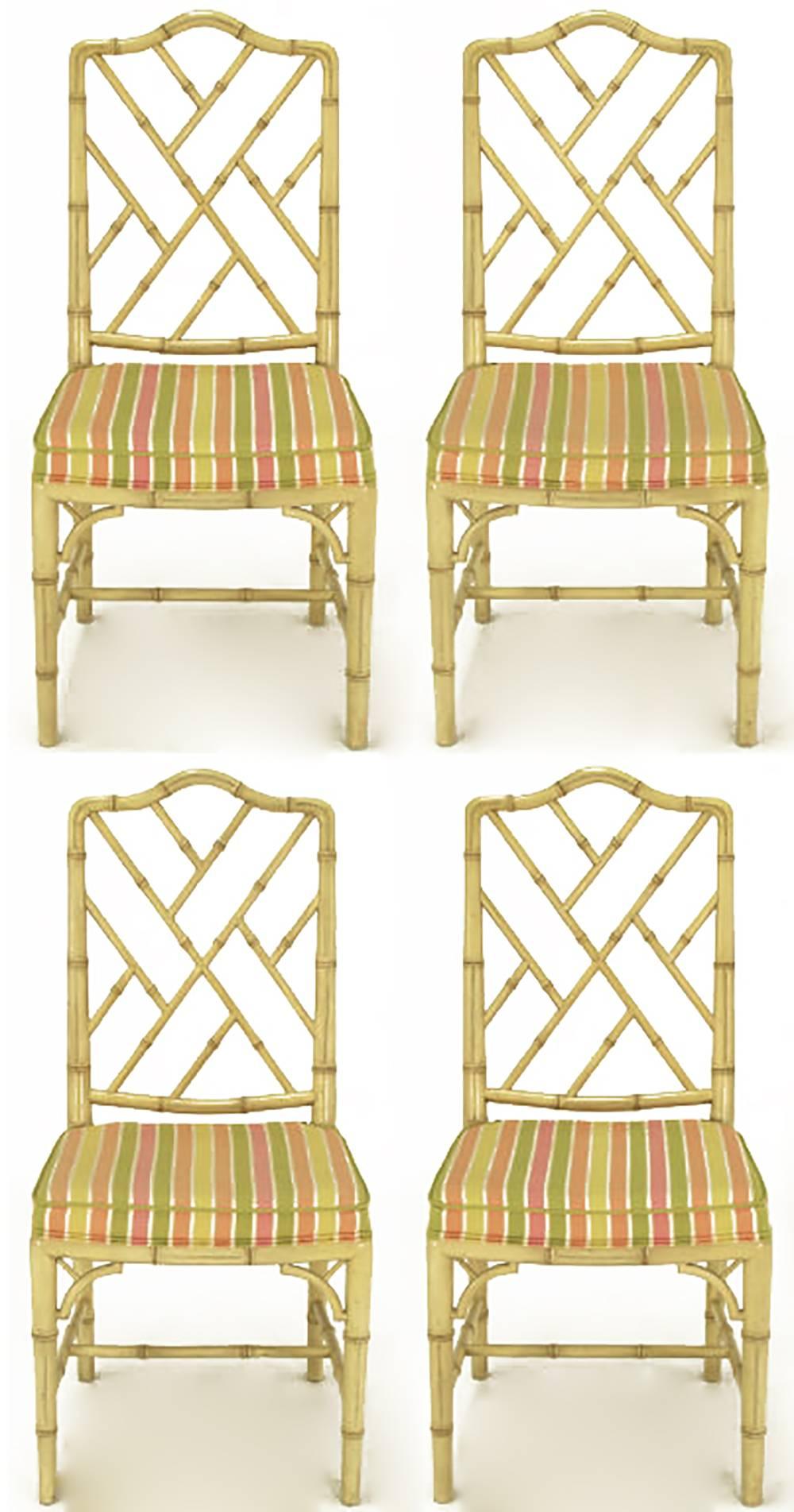 Set of four Kindel furniture of Grand Rapids Chinese Chippendale dining chairs in antique ivory lacquer with original vibrant silk stripe upholstery. Faux bamboo frames with arched back and bracketed front legs.
Kindel Furniture, for over 100