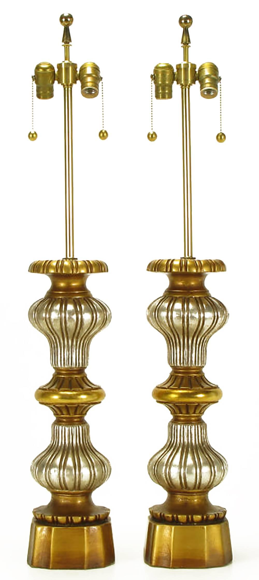 Heavy cast plaster of Paris Regency style table lamps in alternating gold and silver leaf gourd-form segments. Sold sans shades.