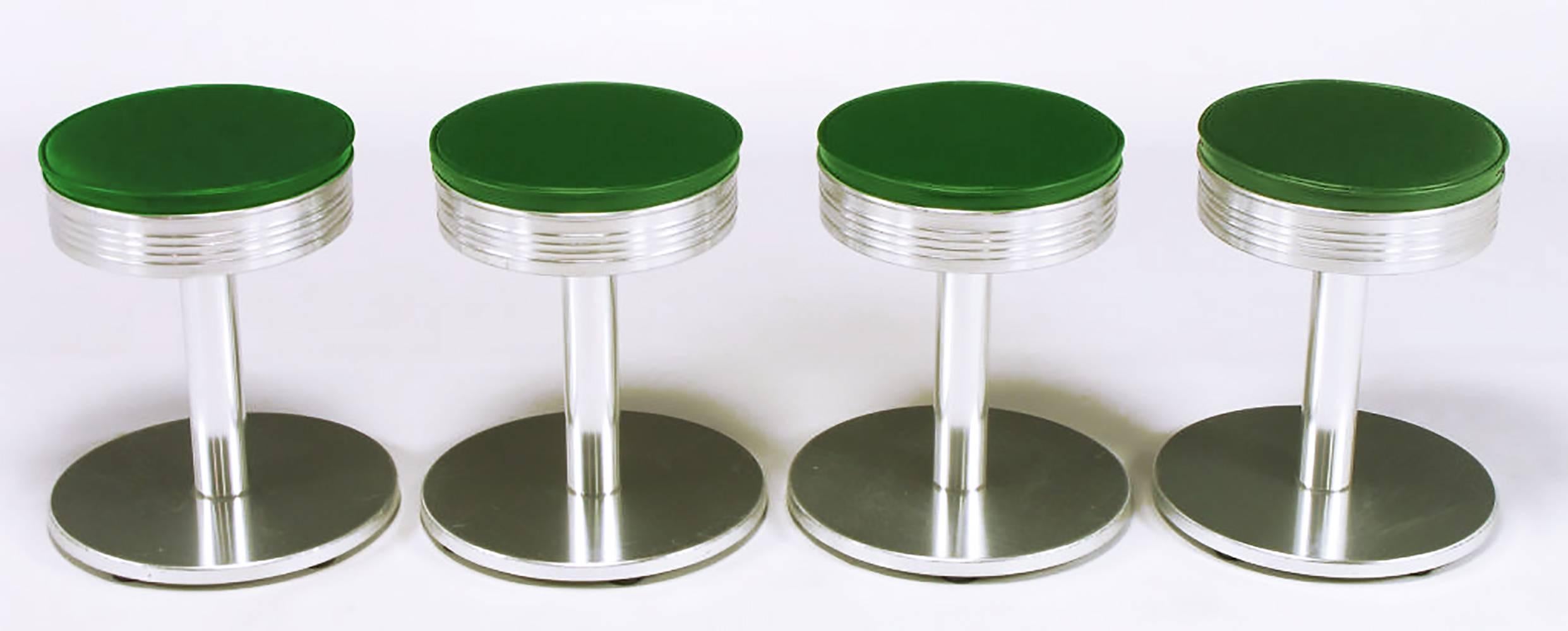 Set of four vintage Michigan H45 aluminum and green vinyl low stools by Joan Casas Y Ortinez for Indecasa, Barcelona Spain. This design, from the Classic Collection, has the feel of the Classic American counter stool with the added European flair.