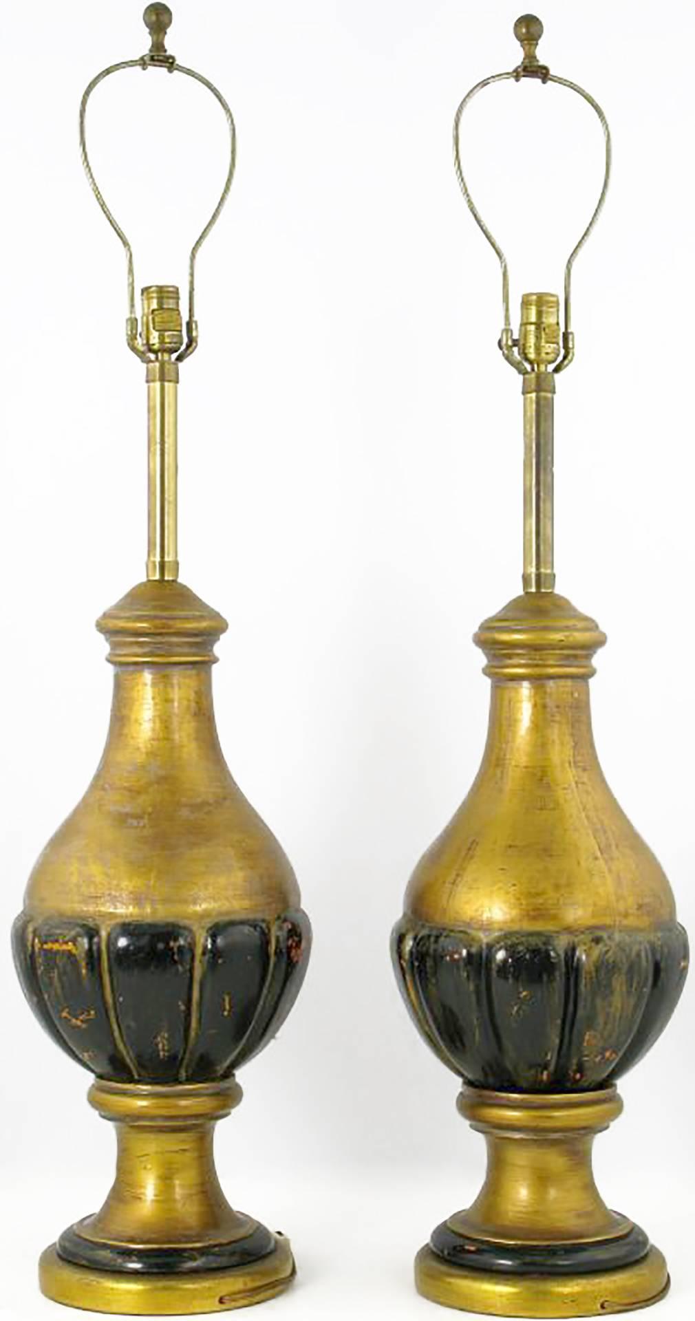 Pair of substantial table lamps by Marbro. Wonderfully distressed from natural use, the gilt and painted wood gourd-form bodies have a patina that only age can bring. Sold sans shades.