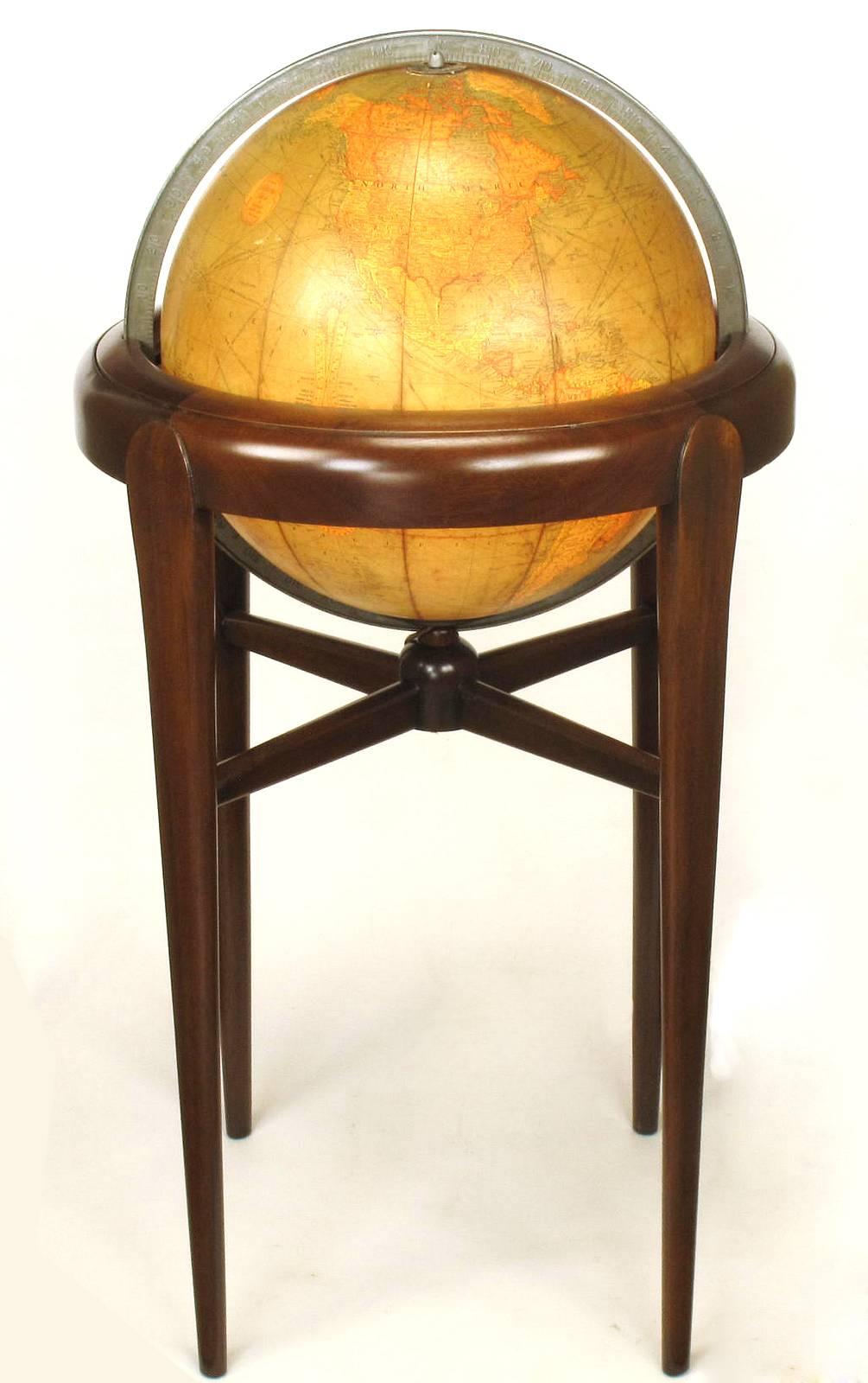 Excellent 1940s Replogle paper covered glass globe on mahogany Stand. The Stand is articulated 90 degrees side to side and 360 degrees around. The stand has been restored while the globe is left with it's original patina. A pull switch underneath