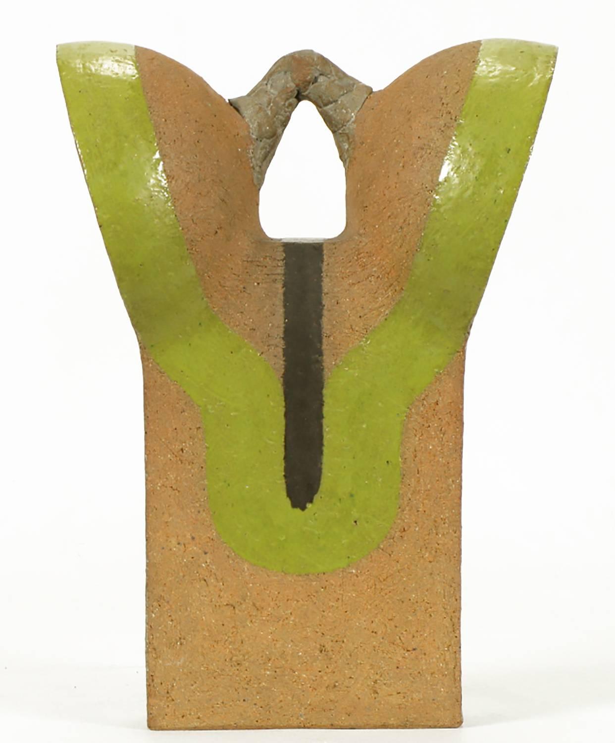 Tomiya Matsuda (1939-2011) terra cotta and earthen pottery abstract ceramic sculpture with chartreuse and black glaze. Multi dimensional piece that changes shape with each turn.

From the estate of William August Hoffman, a professor of ceramics