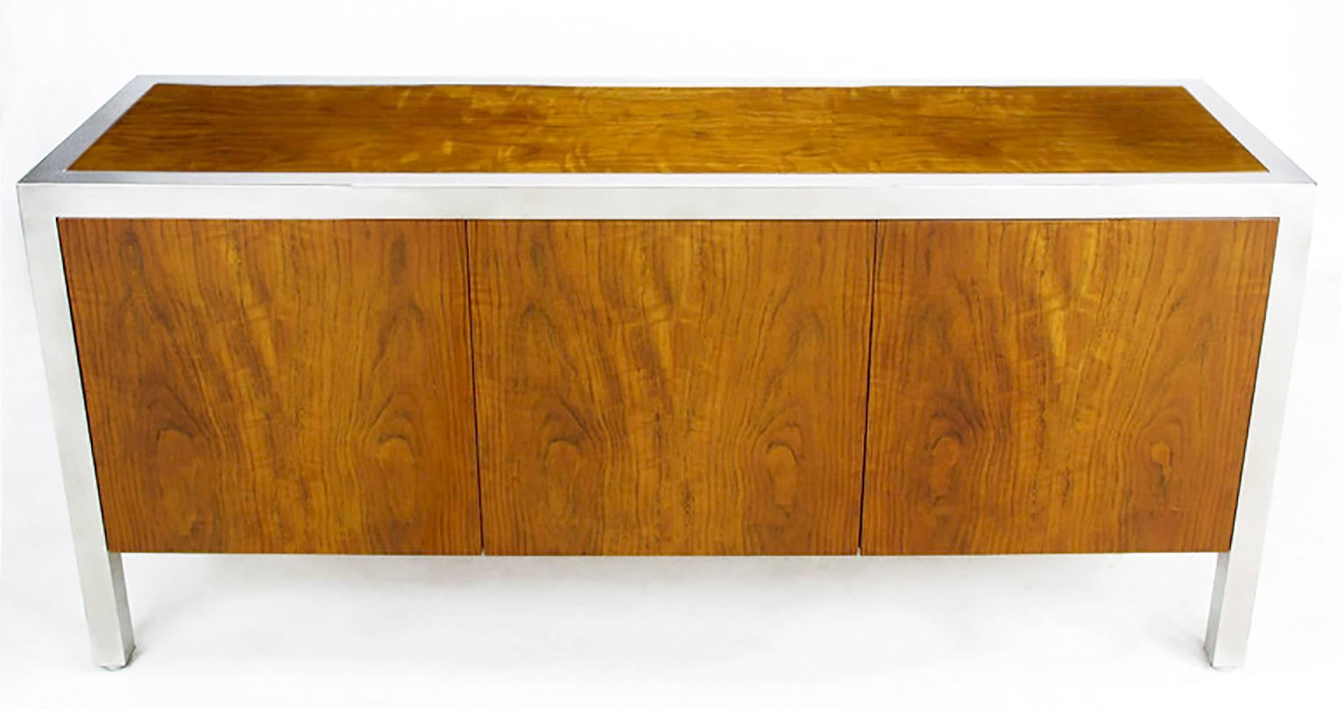 Rare Pace Collection sideboard/cabinet in highly figured and iridescent fiddleback koa wood. Heavy polished steel frame supports the cabinet on every side with parsons style simplicity. Beautiful wood grain with an iridescent property that reveals