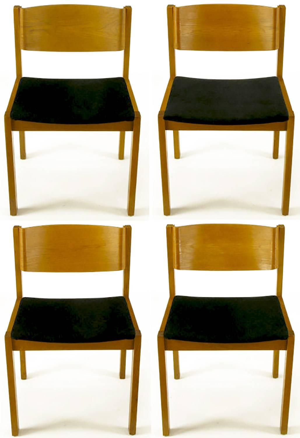 Set of four bleached mahogany frame and bent plywood back dining chairs with new textured black chenille upholstery. Made in West Germany and sold through Harvey Probber, Fall River Mass.
