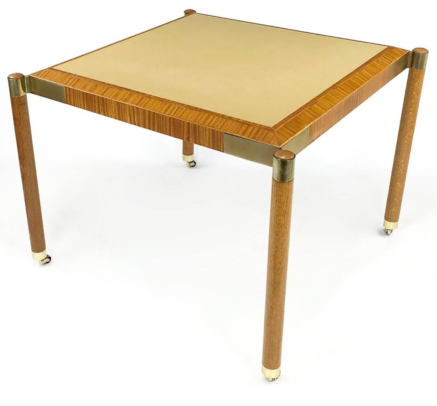 Rare John Saladino for baker, Facade collection, game table, circa 1995.
Very few made and even fewer offered, post modern game table in ribbon mahogany, camel leather, white oak and brass. Externally supported oak legs with brass sabots and