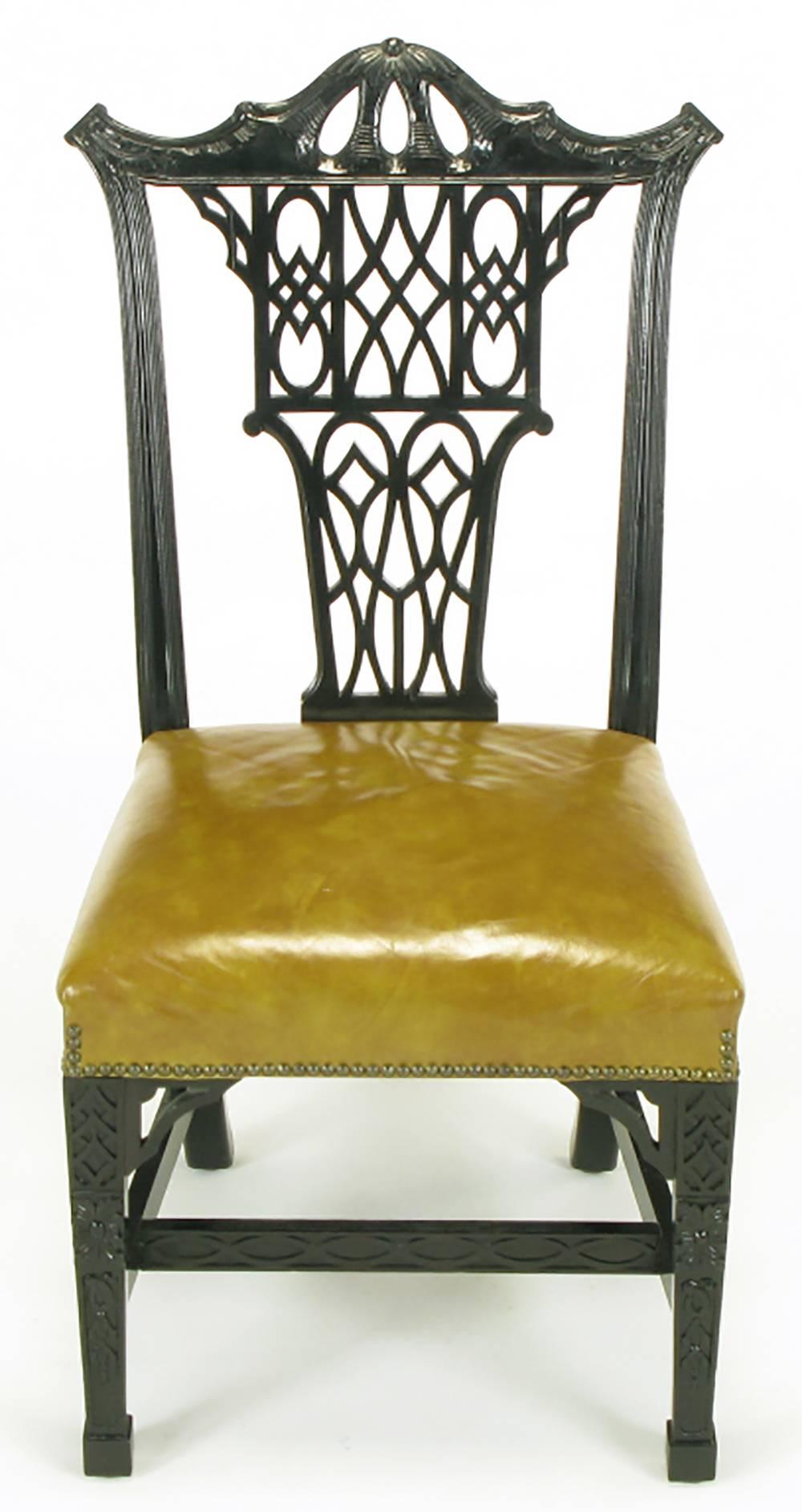 Set of eight early century chair company transitional dining chairs. Influenced by George III and Chinese Chippendale styles with straight front legs with closed fretwork and carved panels to the side and center stretchers. Sienna toned leather.