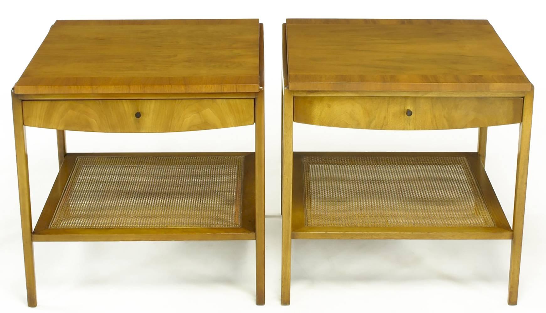 Pair Widdicomb bleached walnut and cane two-tier, single drawer end tables. Sleek and simple design with a floating drawer cabinet with a parquetry bordered top. Lower tier is framed in bleached walnut and cane center. Unexpected curvature to side