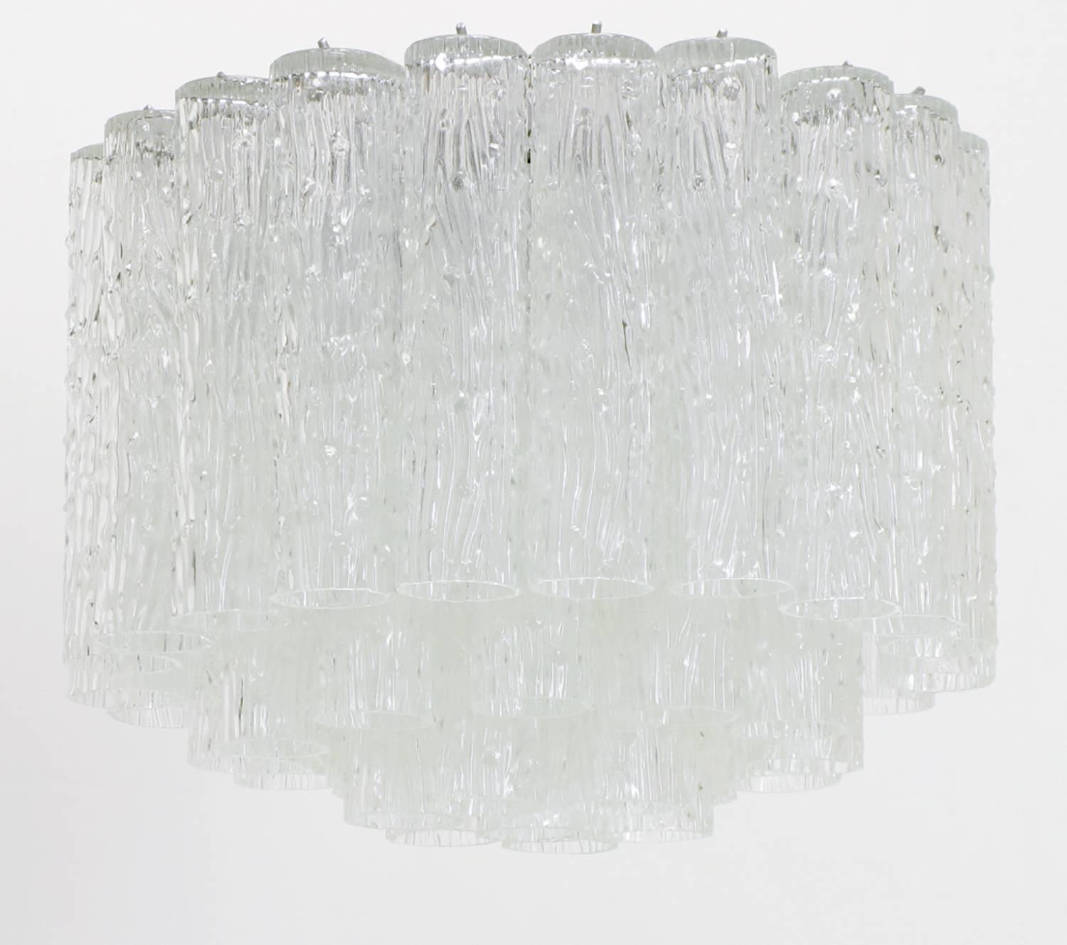 Custom designed flush mounted chandelier with four tiers of textured Murano tronchi glass tubes. Silver lacquered frame can be used as a flush mounted fixture, or as a hanging chandelier, with the addition of chain and canopy. From a Miami high rise