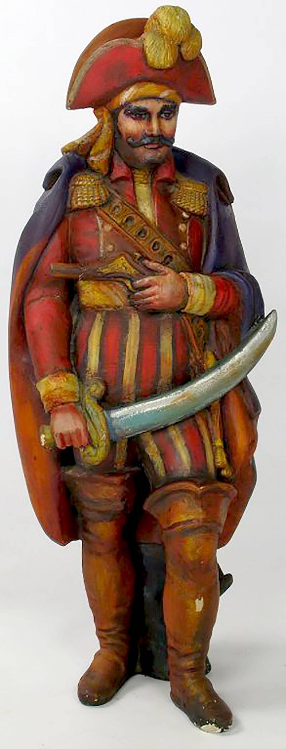 This colorful statue of the pirate, Jean Lafitte, was custom-made for the Chicago restaurant of the same name, which was open from the 1950s into the 1970s. Wonderful shades of red, yellow, orange and purple. Brandishing a flintlock pistol and a