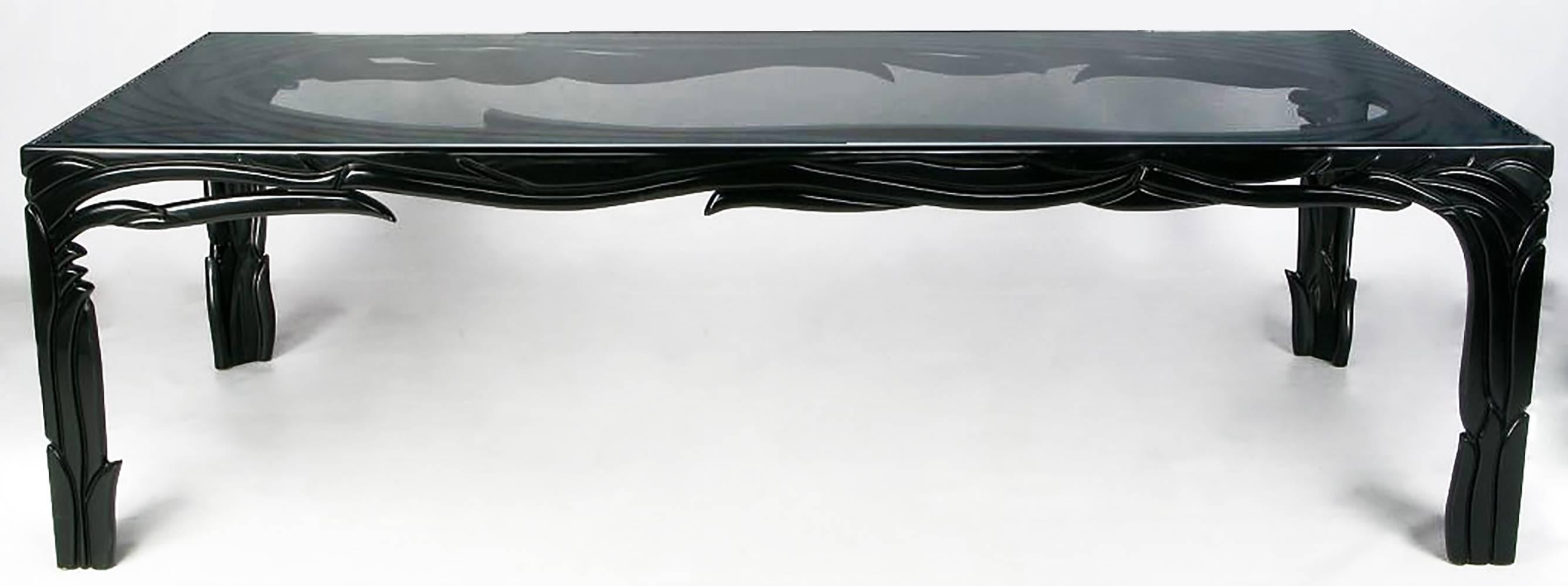 Functional art is the best way to describe this incredible table by Beverly Hills design icon Phyllis Morris. Black lacquer over hand-carved wood in a deco foliate design. Inset with a 1/2