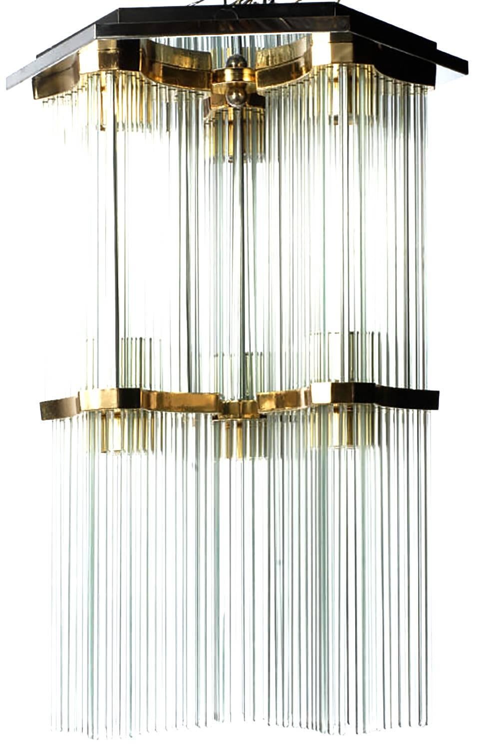 Gaetano Sciolari for Lightolier glass rod and brass two-tiered waterfall flush mount chandelier. Chrome-plated hexagonal ceiling mount with six brass plated reverse trefoil fitters. Six lights, one light for each glass rod section.