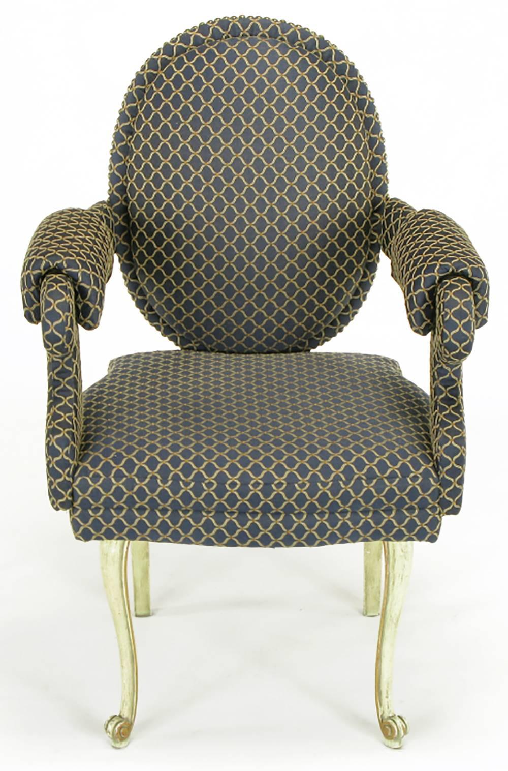 Unusual in being a mix of Louis XV and Louis XVI elements, as well as the distinctive upholstery treatment, these chairs have incredible lines. Everything above the legs is upholstered in a royal blue and cream fabric, including the arms and the