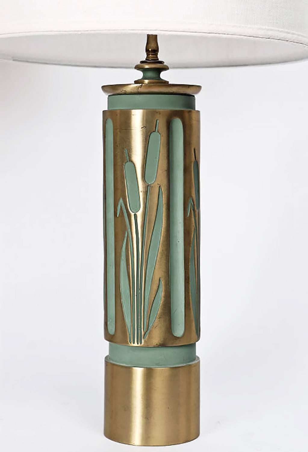 Rare and unusual pair of table lamps, cast with cattail design. Components machined with amazing precision, including the matching finned finials. All recessed areas painted an Art Deco sage green. Single brass sock with three way switch, brass harp