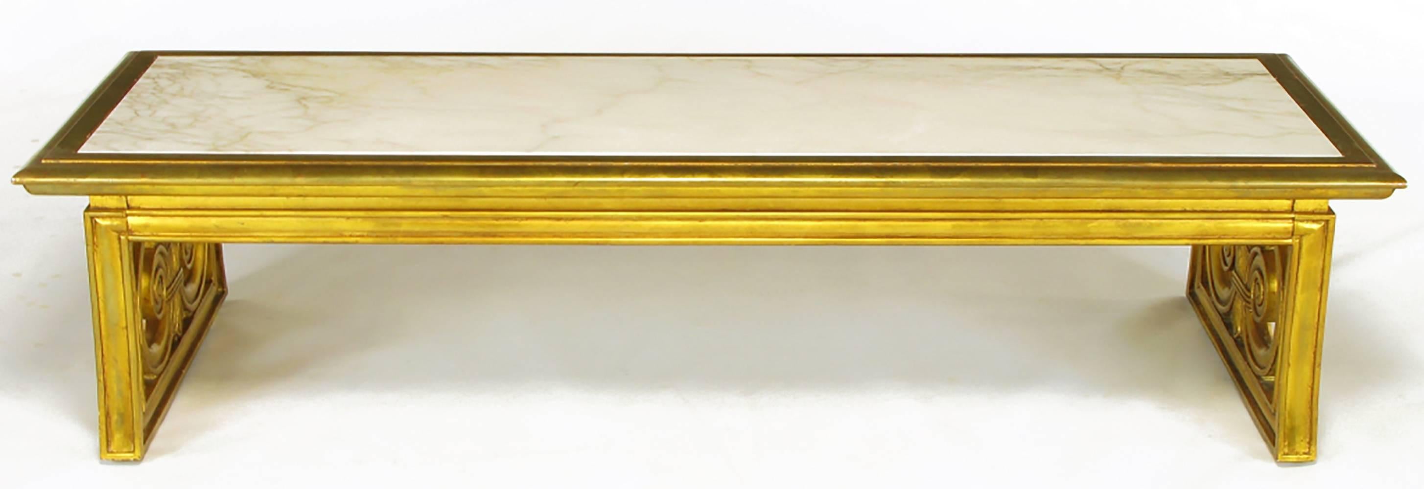 Neoclassical rectangular coffee table with carved and giltwood open sided sled base. Double beveled top frame with recessed apron and stylized sheaves of wheat side panels. Beautiful Portuguese Calacatta white marble with gold veining. Often