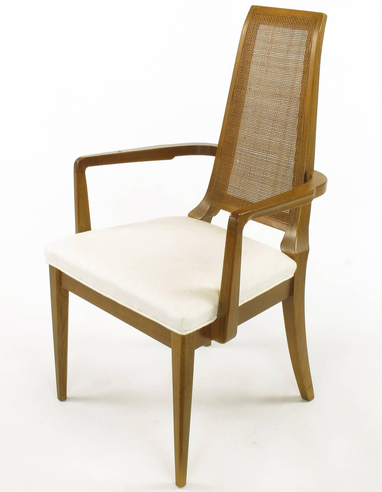 Sleek, circa 1950s Modern Walnut and Cane Dining Chairs In Good Condition For Sale In Chicago, IL