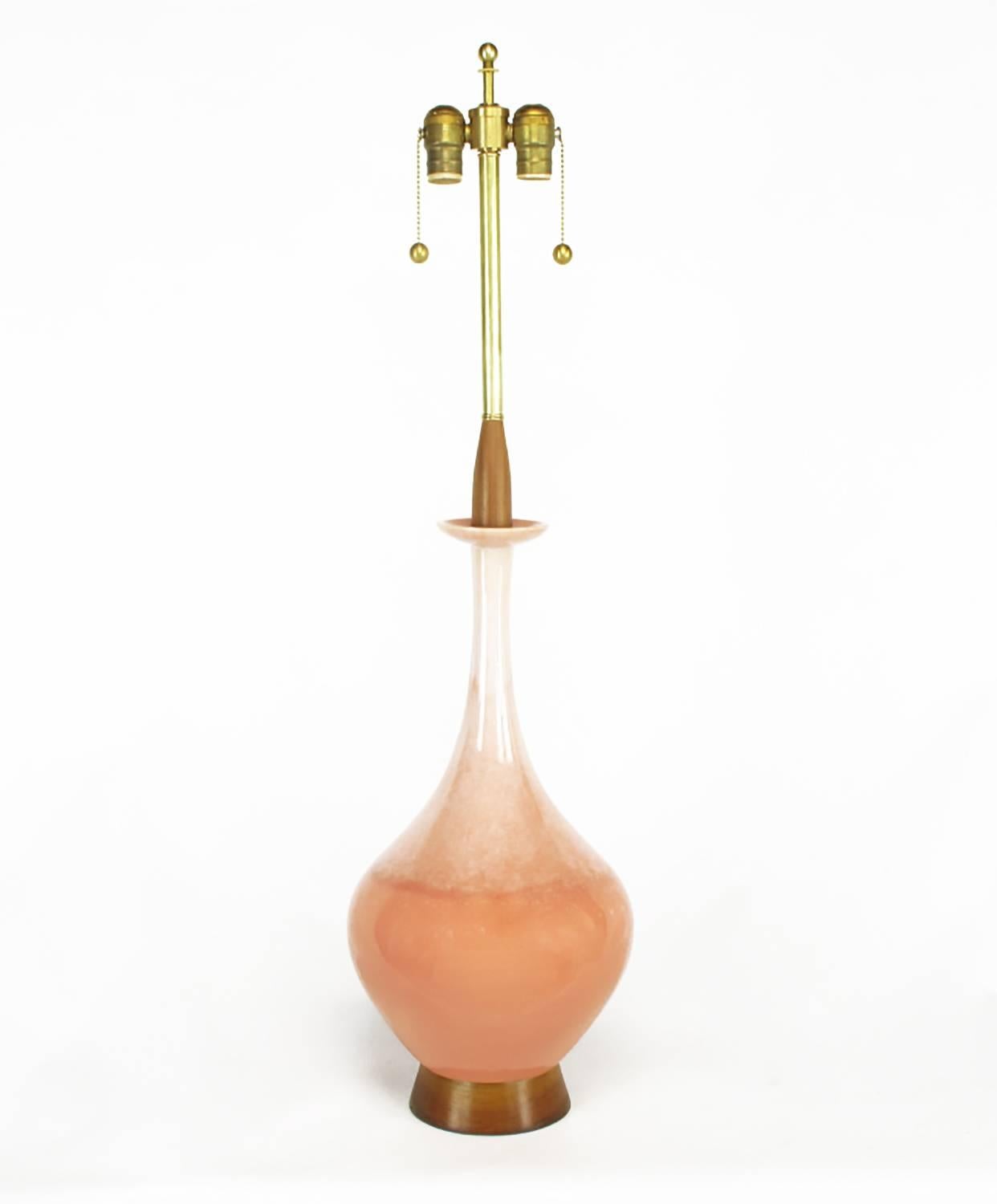 Coral drip glazed ceramic gourd form table lamp with intrinsic bobeche, walnut wood base and partial stem. Brass stem and double cluster socket. Sold sans shade.