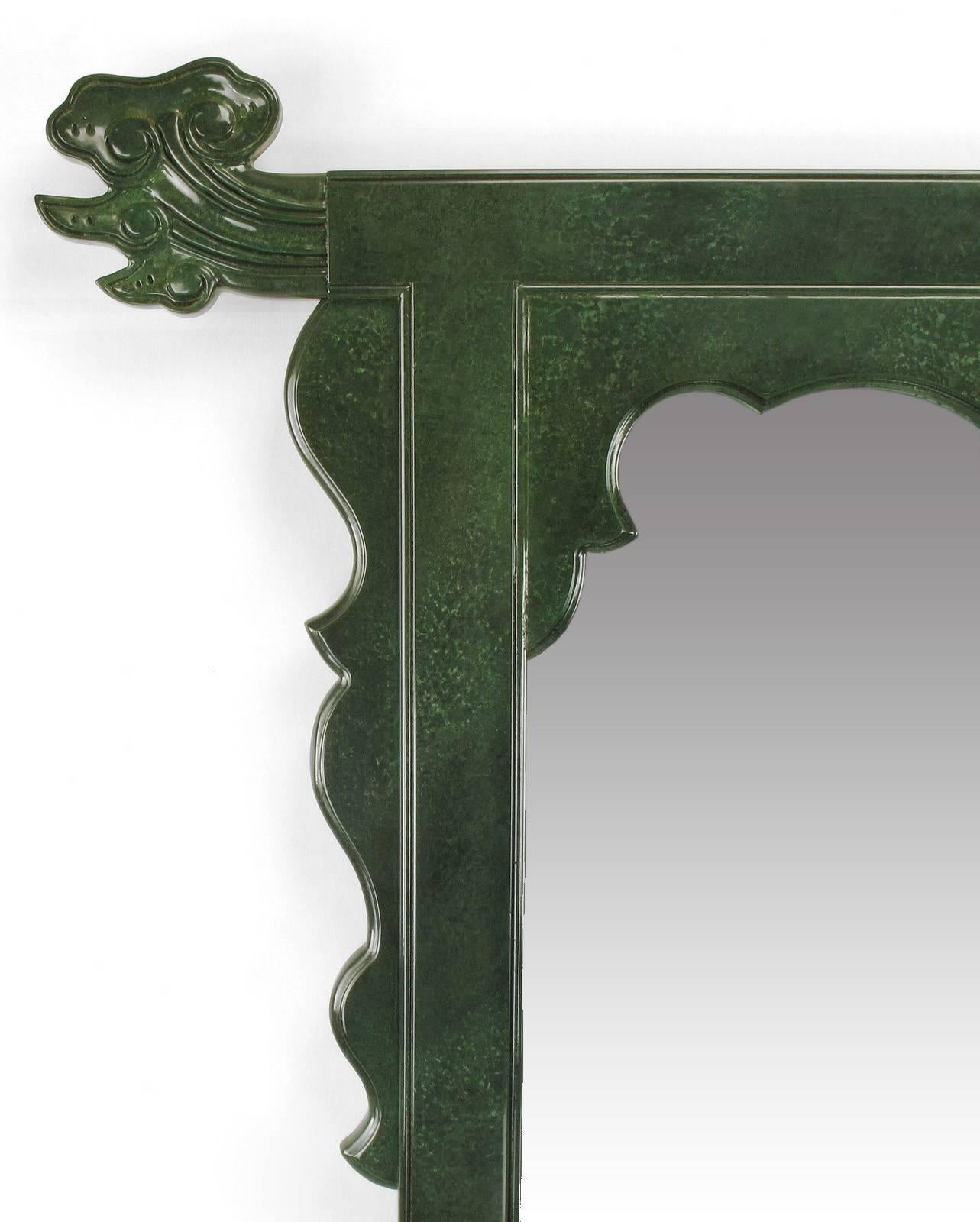 Asian inspired wall mirror comprised of carved wood with heather green hand-painted lacquer finish 52