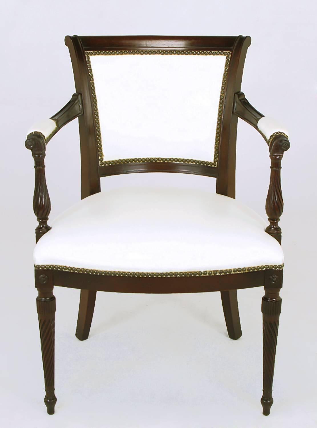 Set of six 1940s Louis XVI inspired dining chairs in the manner of Grosfeld House. Two armchairs and four side chairs; the armchairs have a wider seat and back with perfectly placed leather padding to the front of the arms. Twisted fluting to the