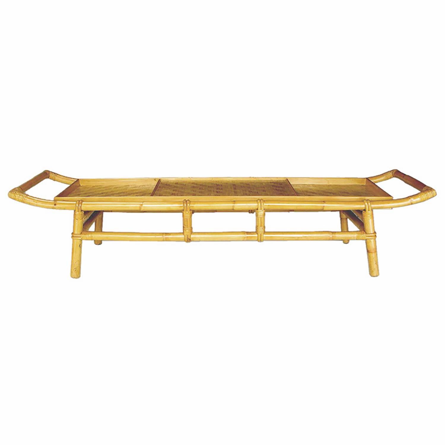 Alluring coffee table in bamboo with pagoda-form top and woven bamboo surface. Integral matching tray. Attributed to John Wisner for Ficks Reed.