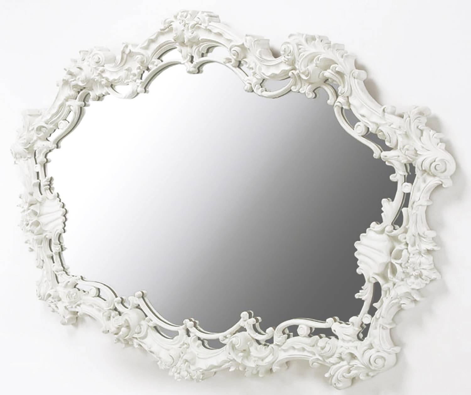 Extraordinary cast gesso Italian Rococo style mirror in white lacquer with filigree and shell detail. Perfect for a vanity, over mantel or in the bedroom over a long dresser. Serge Roche and Dorothy Draper were both proponents of monochrome white