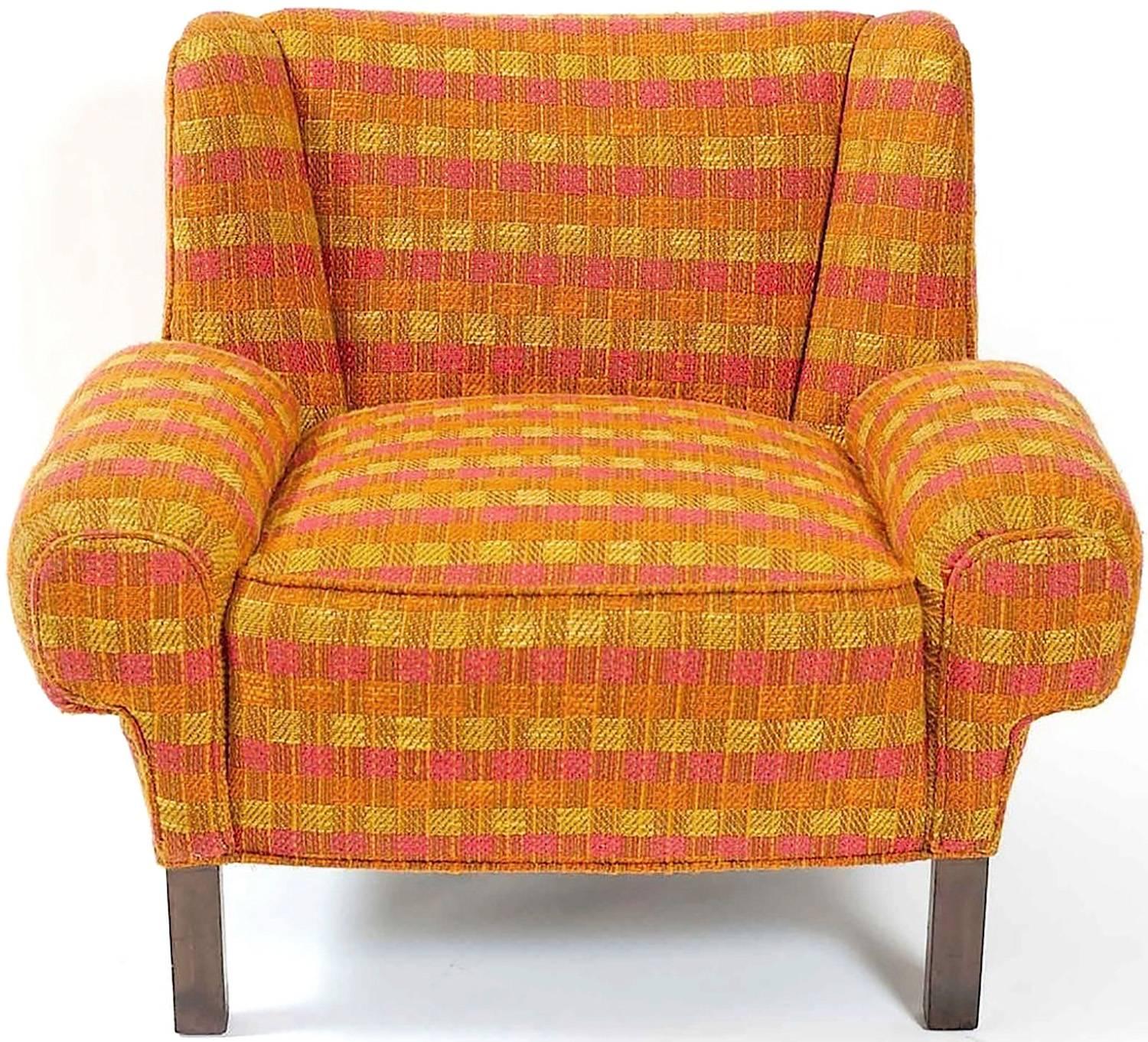 Rare pair of Paul Laszlo for Herman Miller Model L-689 lounge chairs, circa 1948. Original checked nubby wool upholstery in very good condition, a pleasing mix of orange, magenta, and gold. Legs of dark wood.