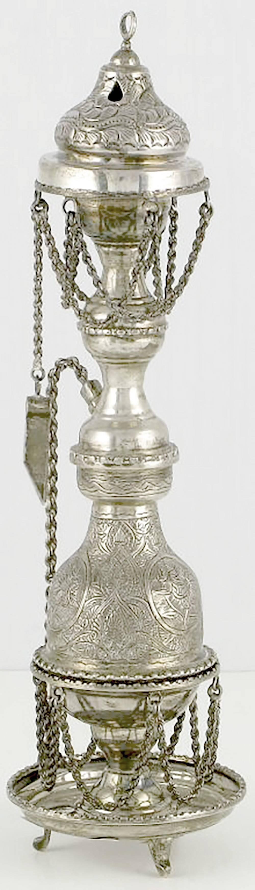 Exquisitely worked multi-tiered incense burner from Persia/Iran. Decorative woven chain, cutter and extinguisher all add to the charm of the piece.