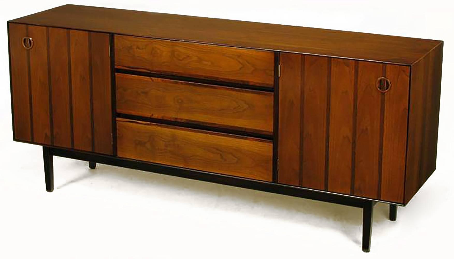 American made parquetry front long dresser with two hinged doors and three drawers. Doors consist of alternating walnut and rosewood strips and are hinged to the inside edge. Three large drawers are cover in walnut with rosewood edging to the top