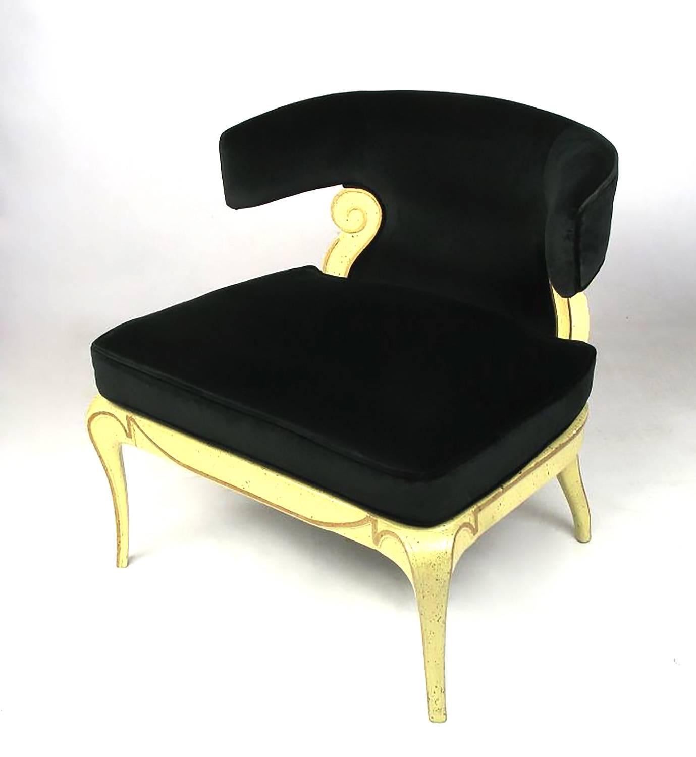 Grosfeld House slipper chair with new black velvet, aged creamy lacquer and parcel-gilt finish. Unusual tapered legs and curved back.