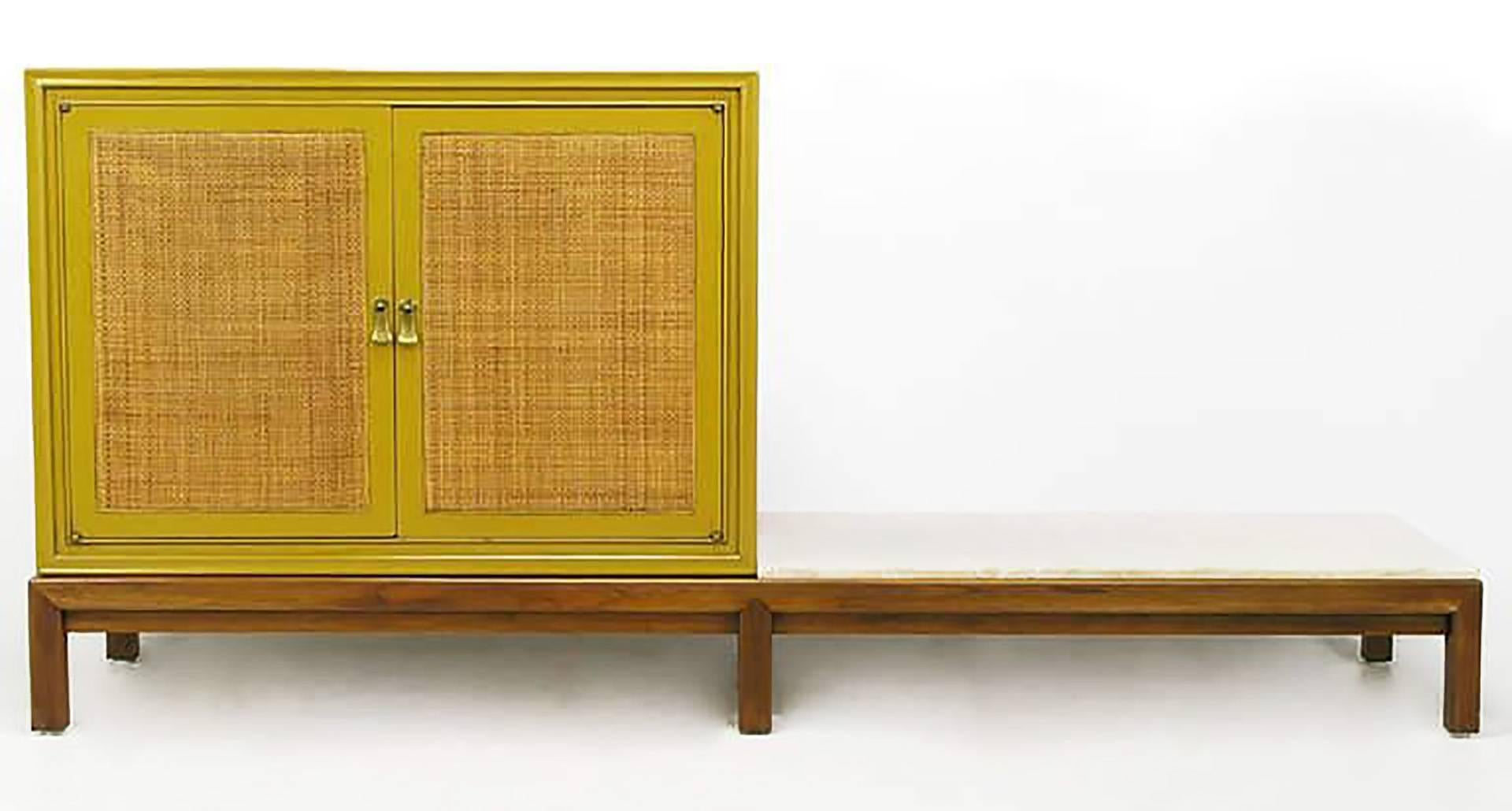 Single saffron yellow craquelure lacquered cabinet with cane-front doors. Walnut six-leg base, with contiguous marble platform for placement of sculpture, plant, or cushions. From Mount Airy Furniture Company of North Carolina, a quality furniture