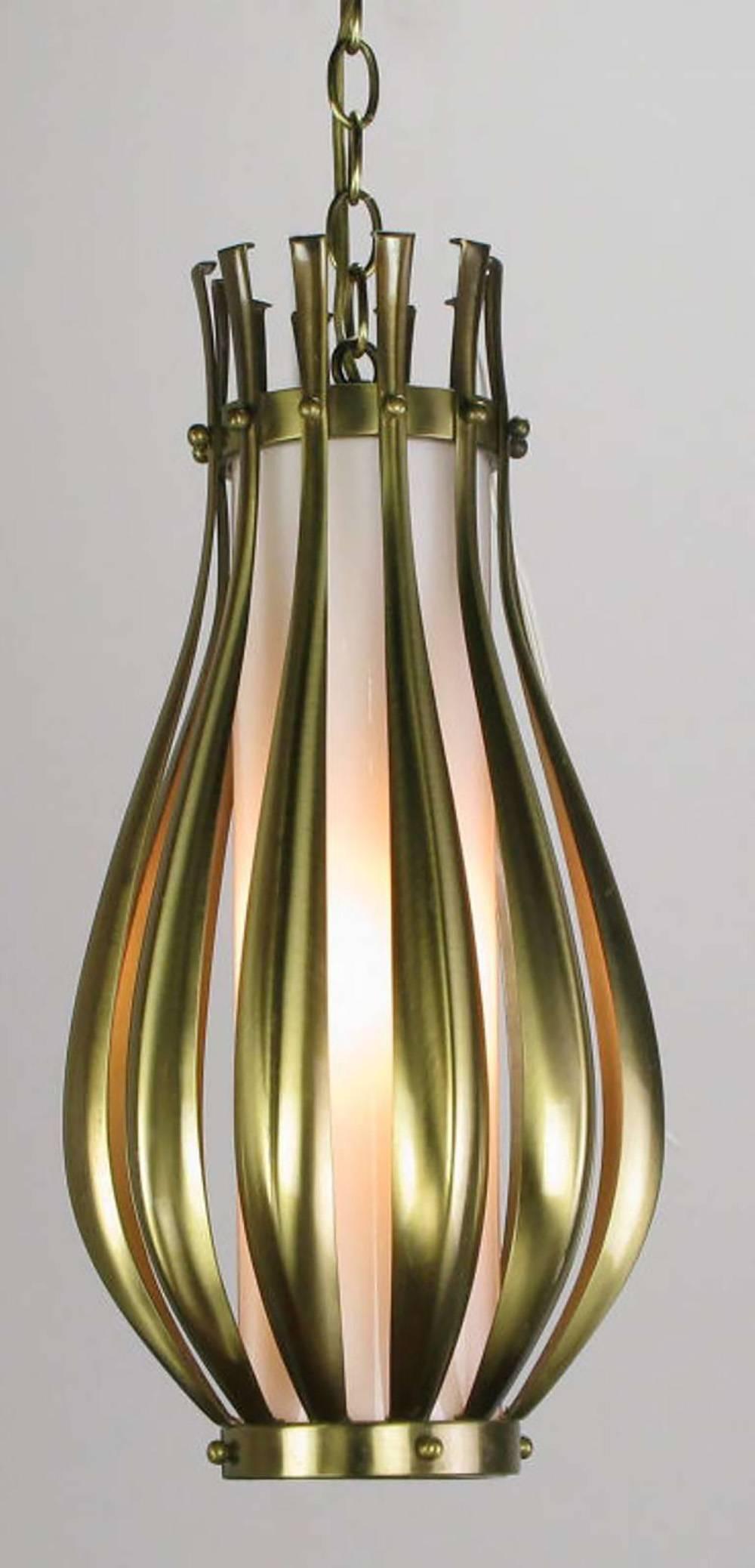 Ribbed and brushed brass gourd form pendant hanging light fixture, with a milk glass internal shade. Detailed with brushed brass balls. Similar to some designs by Gerald Thurston for Lightolier. Single socket incandescent lighting element. Comes