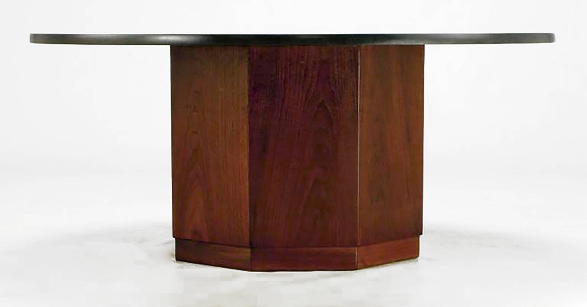 Round slate topped coffee table with an octagonal walnut base by St. Louis architect, Fred Kemp. Kemp was a leading figure in the St. Louis architectural scene for over 50 years. He has designed some of that city's most outstanding residential