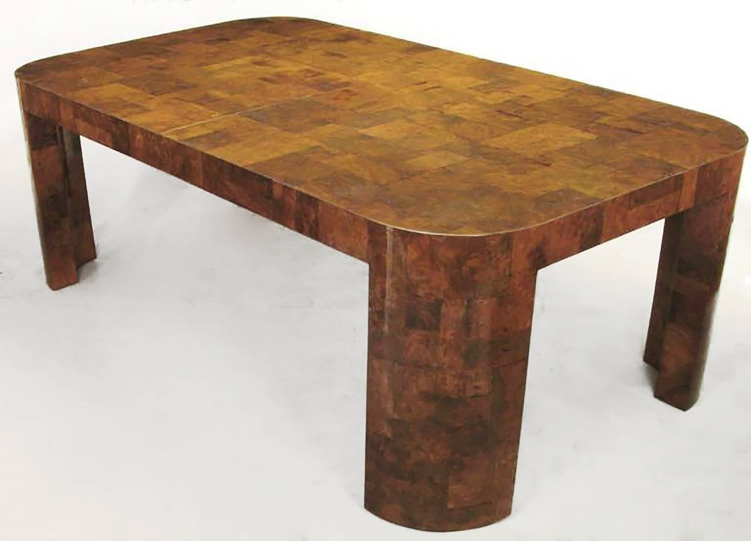 An excellent example of the modern elegance that was Paul Evans' work for Directional in the late 1960s through the middle 1970s. This patchwork dining table in burled walnut has radius corners and legs. The Fine burled walnut veneer of various
