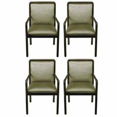 Cuatro sillones Martin Brattrud ebonizados y tapizados