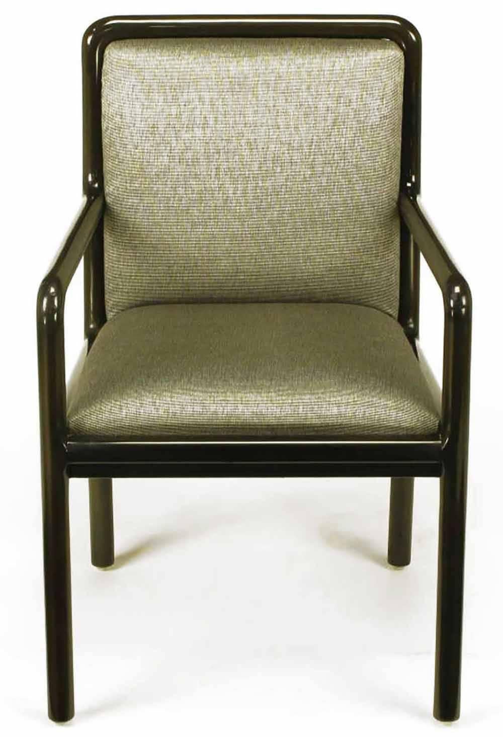 Four Martin Brattrud armed dining chairs. Wood frames are radius and ebonized to a dark chocolate brown gloss. Upholstered in the original heathered grey chintz. Brattrud is a custom furniture manufacturer from Gardena California that has been in