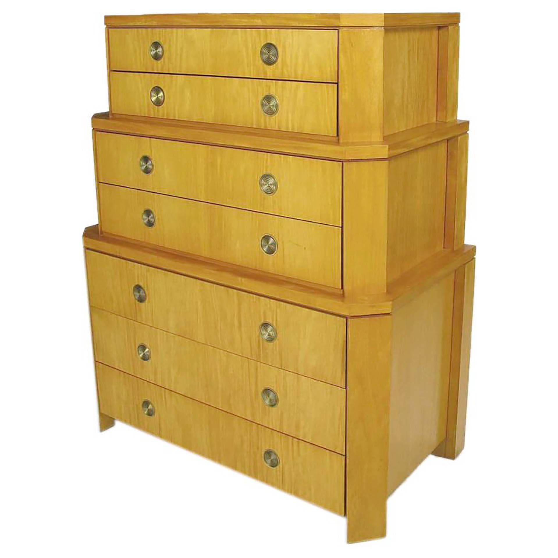 From the only collection of residential furniture by renowned San Francisco designer Charles Pfister (1940-1990), this three section chest with canted corners was offered through Baker for only a short period. The concentric pulls are pivoting brass